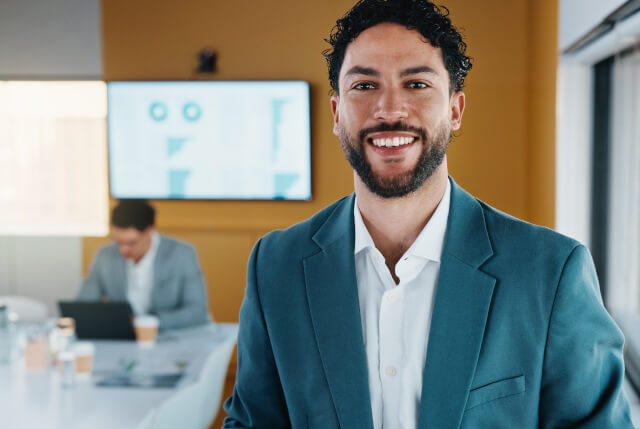 Smiling man in boardroom